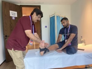 Pakistan contingent Dr ASAD ABBAS giving treatment to athlete in village